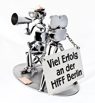 Schraubenmännchen Filmemacher mit Schild Schraubenmännchen Filmemacher mit Schild