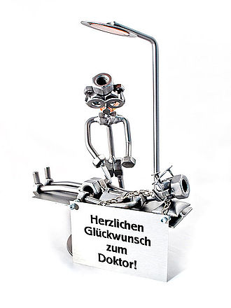 Schraubenmännchen Facharzt mit Schild Schraubenmännchen Facharzt mit Schild