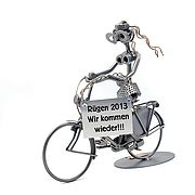 Schraubenmännchen Frau auf Hollandrad mit Schild