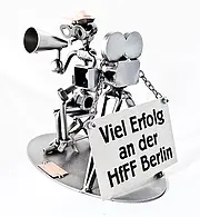 Schraubenmännchen Filmemacher mit Schild